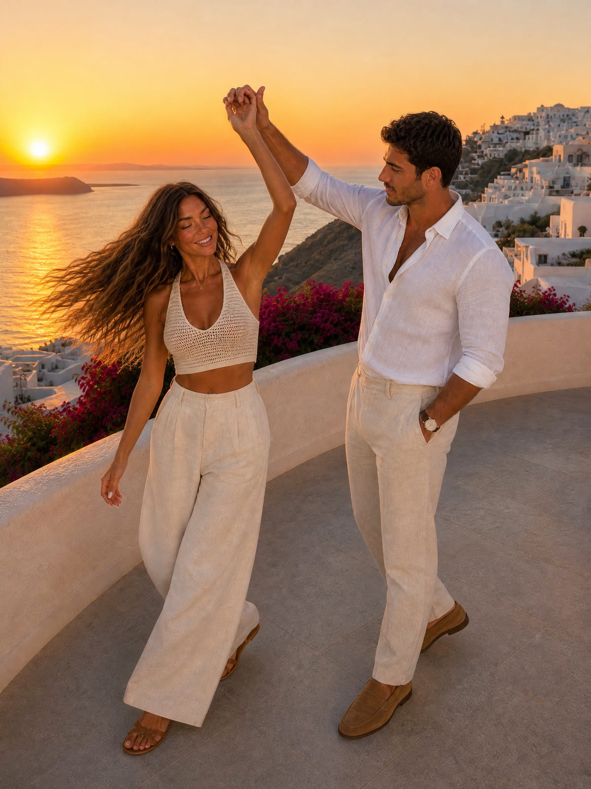 He spins her on the terrace. The same couple in linen outfits in Santorini.