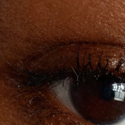 Creative Enhance: the same eye re-rendered, lashes bolder, skin smoother, exposure deeper